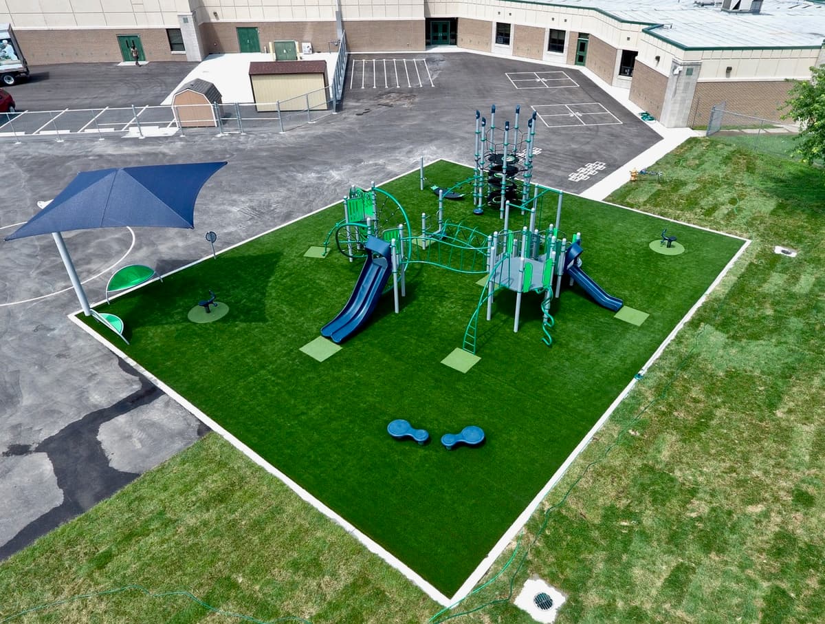 Aerial view of home landscaped with synthetic grass