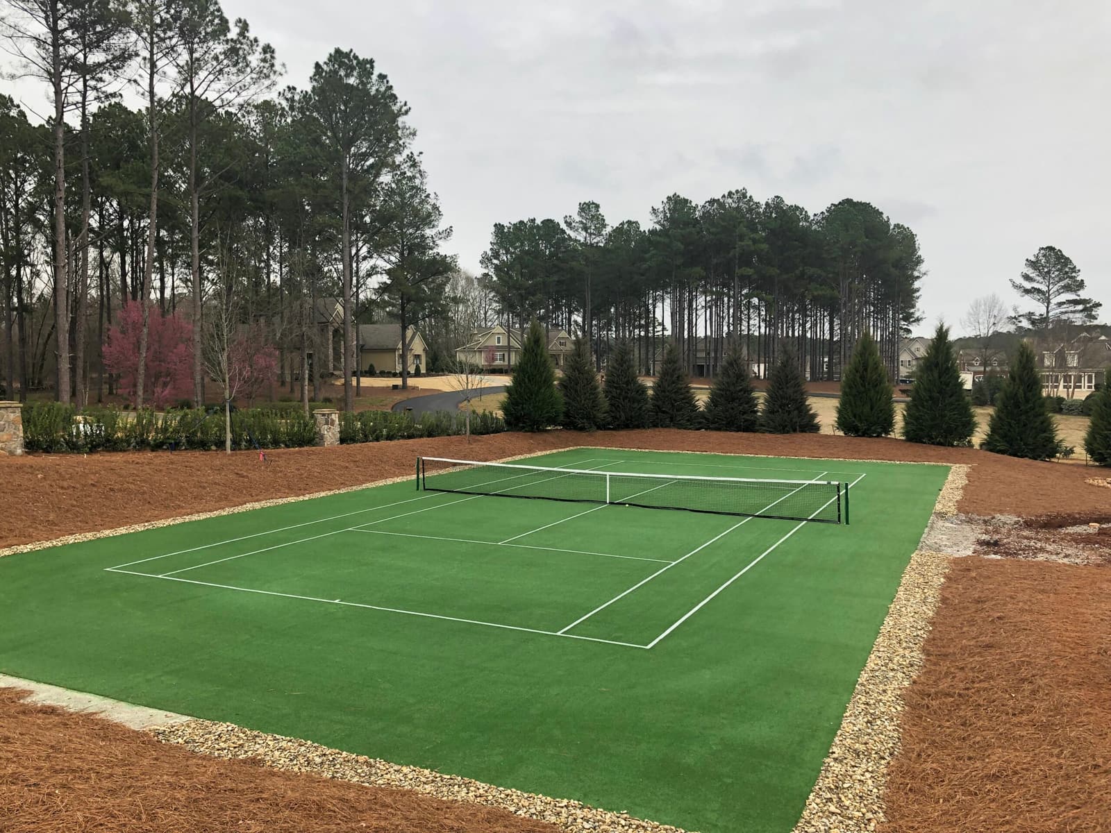 Artificial grass tennis court / sports field installation