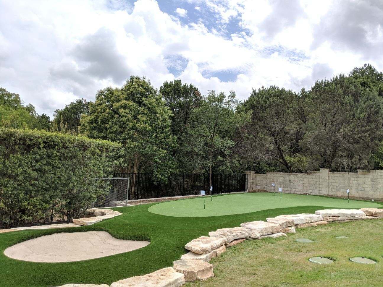 Backyard putting green with sand trap