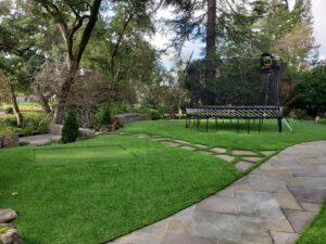 backyard landscaping with low-maintenance artificial grass