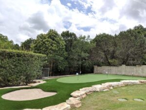 backyard putting green with sand trap